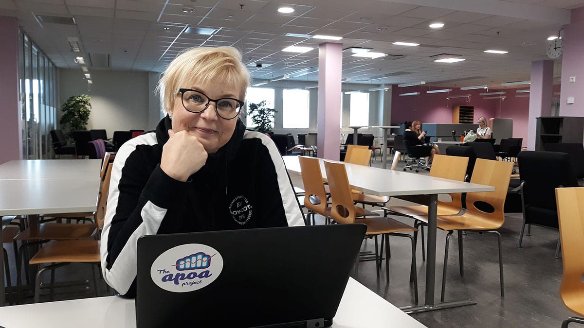 Katja Lempinen working with laptop.