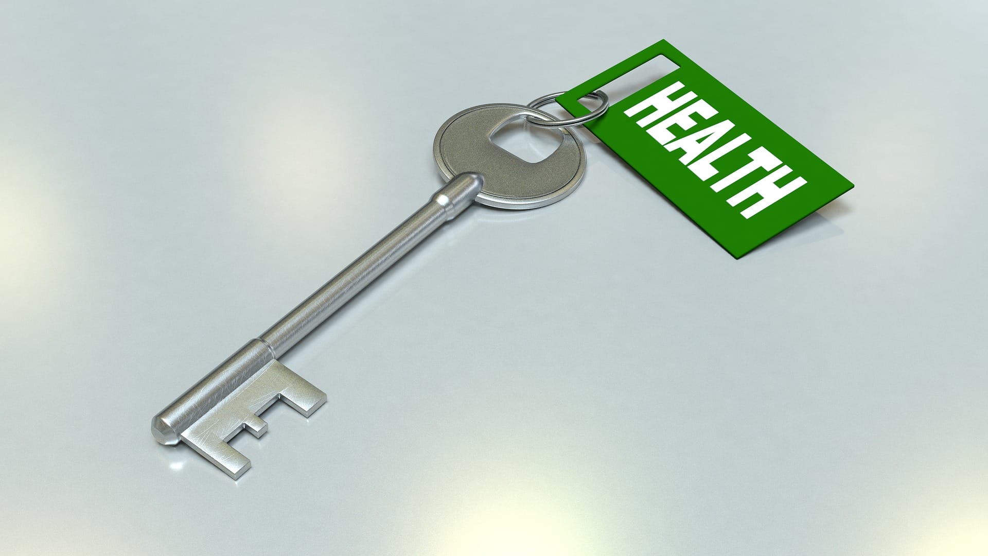 Avain, jossa on vihreä avaimenperä, jossa lukee Health.