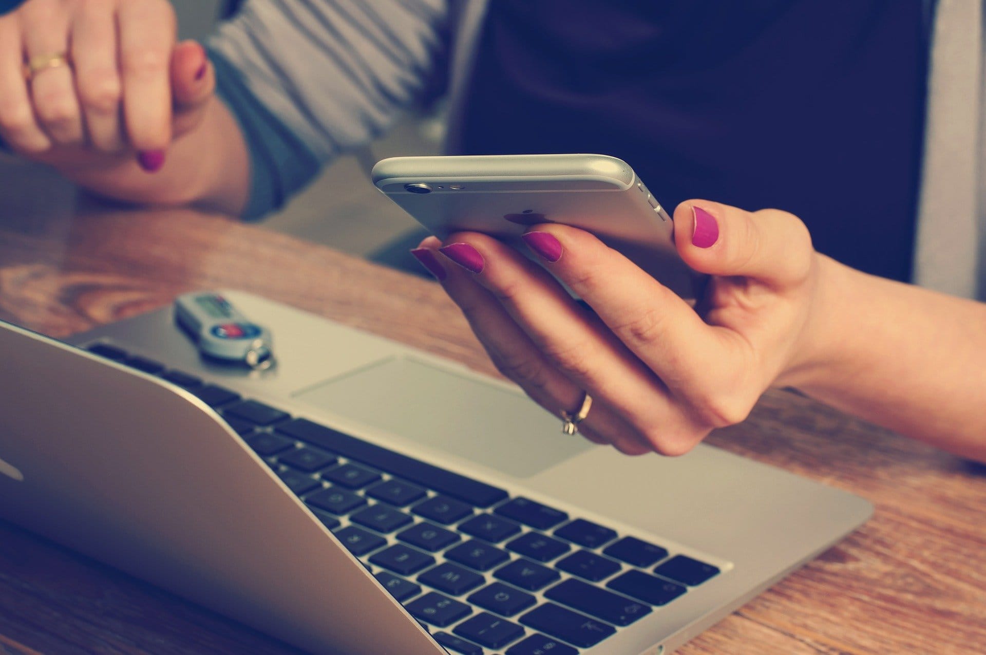 Women with self-phone and laptop.