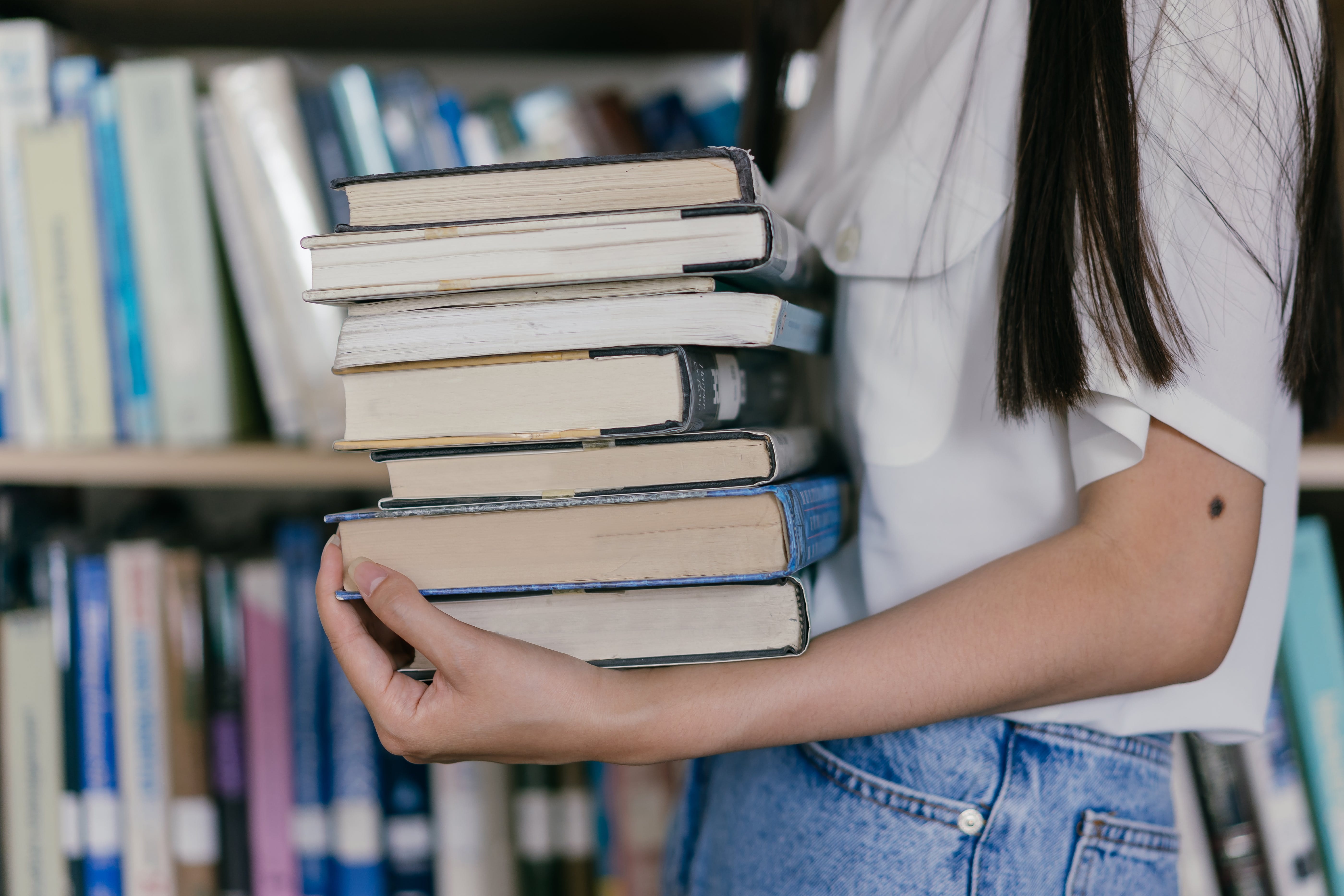 Human holding books.